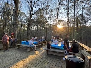 Friends and family gathering outdoors at Creek Lodge